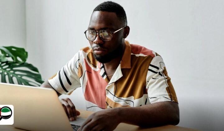 Minimum Share Capital for UAE Free Zone Company: Complete Guide - african man using a laptop and working at a desk