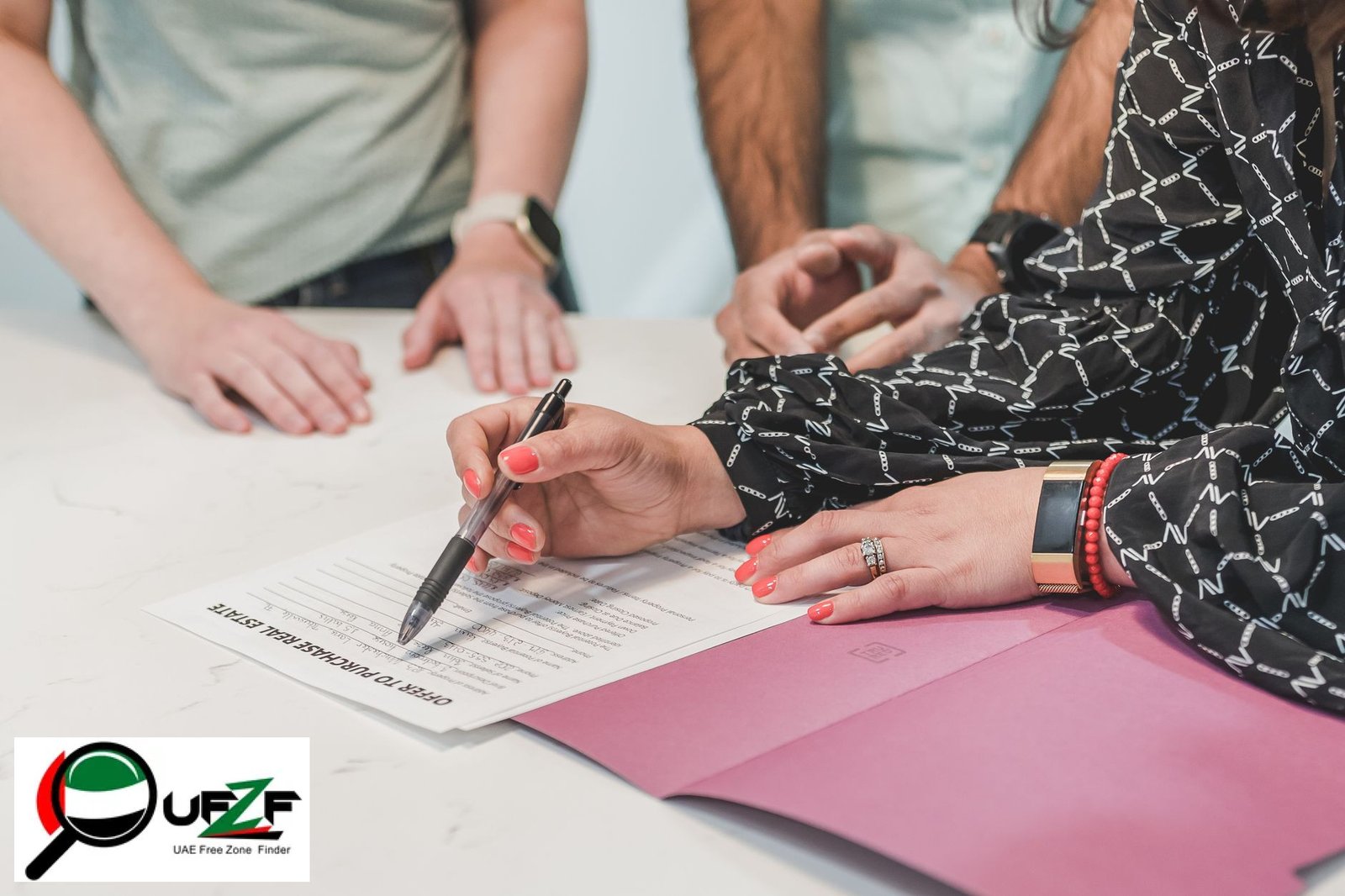 Real estate professional reviewing RERA compliance documents and UAE free zone licence in a Dubai office