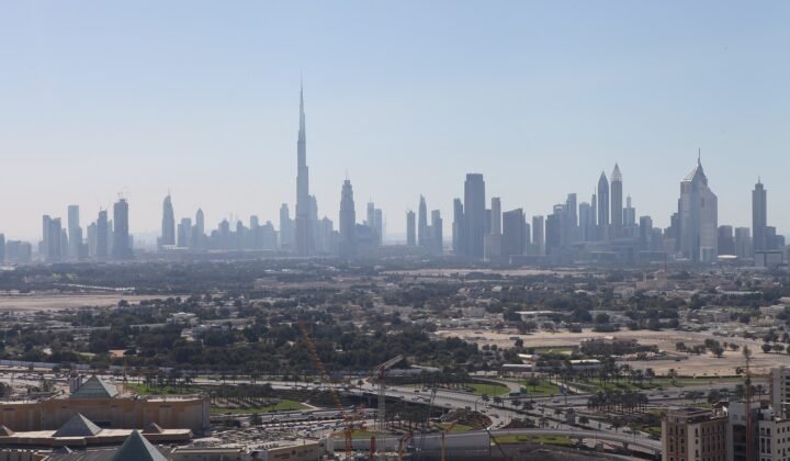 Dubai skyline and Downtown business district, the mainland jurisdiction UAE free zone companies convert into
