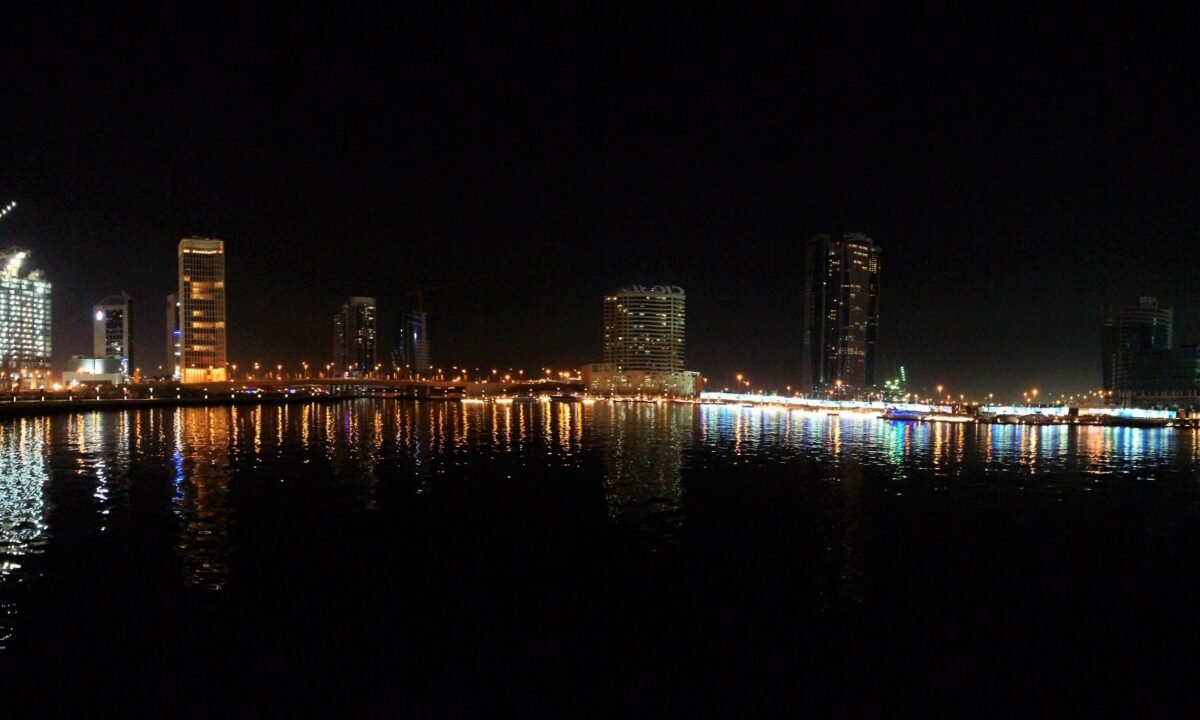Business Bay towers in mainland Dubai at night, the commercial district a dual licence gives free zone companies access to
