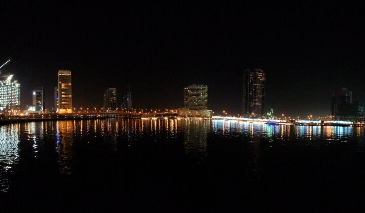 Business Bay towers in mainland Dubai at night, the commercial district a dual licence gives free zone companies access to