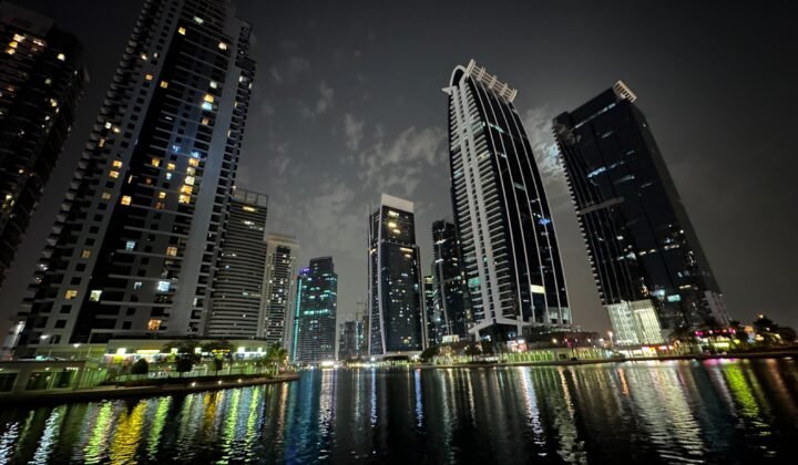 Jumeirah Lakes Towers at night, home to DMCC free zone companies in Dubai