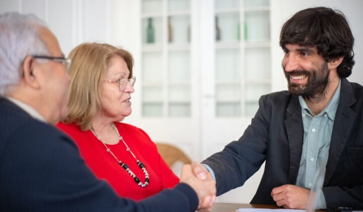 Management consultants shaking hands during a business meeting in the UAE