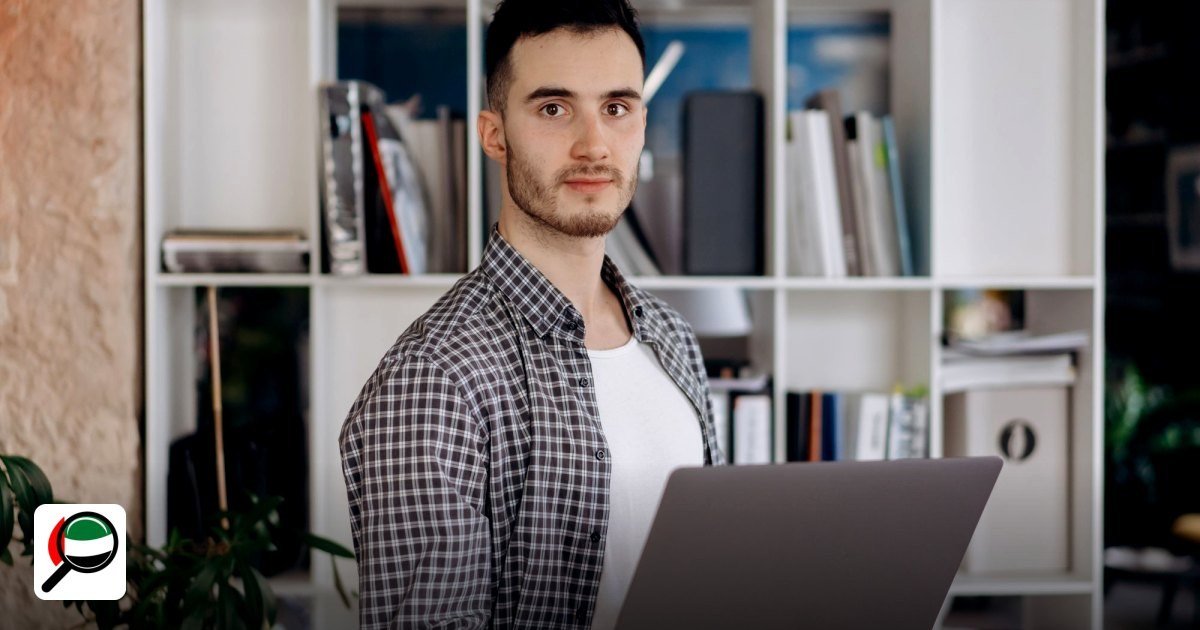 Step‑by‑step guide to setting up a free zone company in the UAE for e‑commerce businesses - man holding laptop in modern